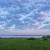 Дзеркальна чистота та багряний схід сонця: фото ранкового Світязя